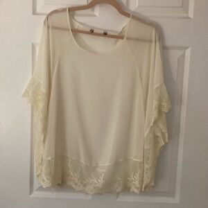 Express cream poncho with lace trim